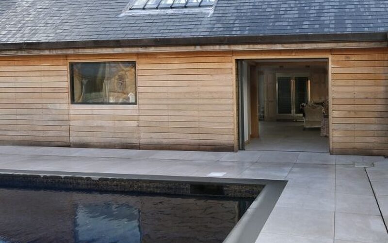 modern barn conversion project with flush finish conservation rooflight integrated into the slate roof